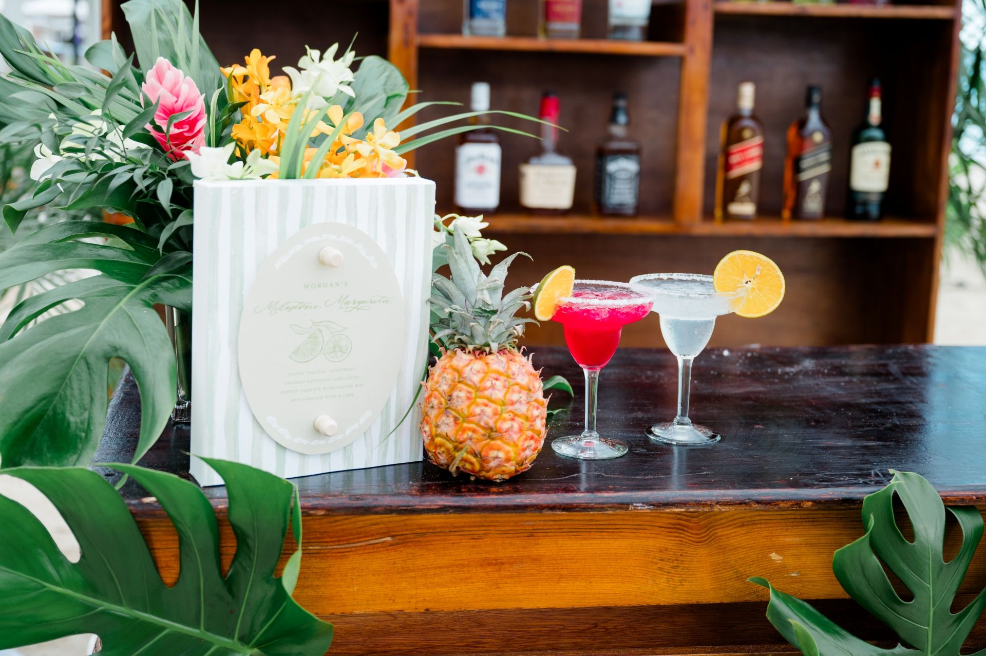 Bar with pineapple, margaritas, and personalized cocktail menu at Sandals Negril