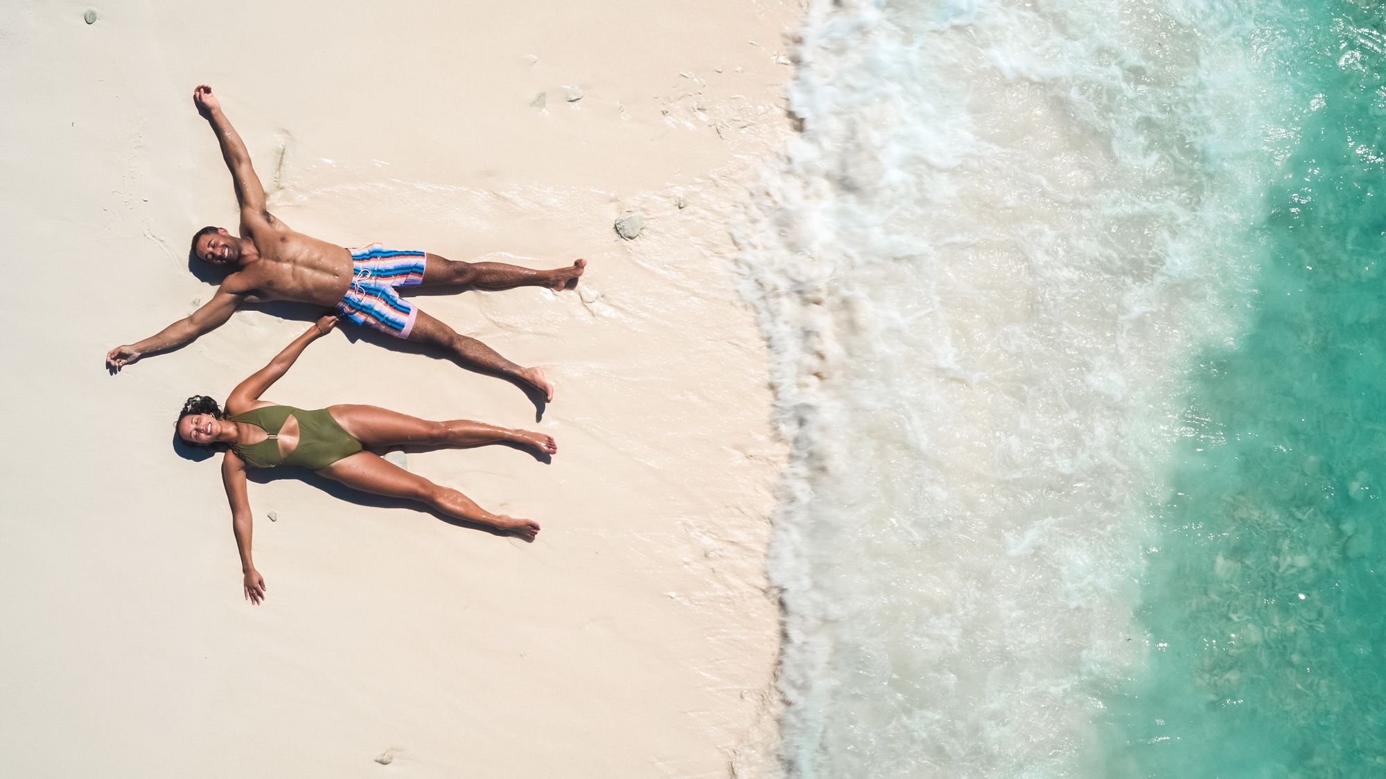 SCR-Lifestyle-Birdseye-view-Couple-Laying-Sand-2